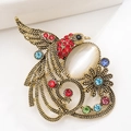 Spilla fenice dorata vintage con strass rossi e pietra occhio di gatto bianca - Oro Vintage Rosso
