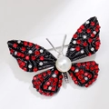 Spilla vintage a farfalla in lega nera con strass rossi e perle bianche - Stile Perla Contrasto Nero Rosso Bianco (XZ147)