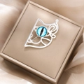 Detail of silver hollow animal brooch with blue cat eye stone in a champagne jewelry box - Silver Hollow Cat Eye Cat Style (X5054 Silver Cat Face)
