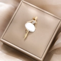 Detailed view of elegant gold ballerina brooch with crystal stones in a jewelry box - Elegant White Ballerina Style (XZ5-327 White Ballerina)