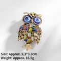 Detailed view of vintage gold owl brooch with colorful crystals and evil eye accent - Evil Eye Owl (XZ24104)