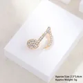 Close-up of gold musical note brooch with white crystals, size 2.3x3.4cm, weight 5g - Note Xz24123
