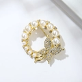 Elegant gold-tone circular pearl brooch featuring a sparkling crystal butterfly - Gold Ring Butterfly (XZ20-030)