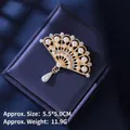 Vintage style hollow fan brooch with pearls and tassels on dark blue silk background - Golden Hollow Fan Pearl Style (XZ24211)
