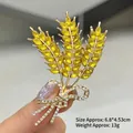 Elegant gold wheat ear brooch pin with yellow crystal inlay and rhinestone bow detail - Wheat Ear Style (XZ24220)