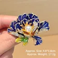 Detailed view of blue enamel peony brooch with white crystals and central pearl - Blue Peony