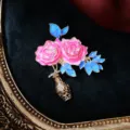 Detail showing pink enamel peony brooch with blue leaves and dimensions 4.6cm by 4.9cm - Rhinestone Rose Vase
