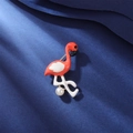 Detailed close-up of flamingo brooch with coral enamel and white pearl on blue velvet - Flamingo Style (Special Offer 1)