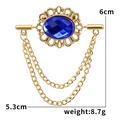 Detail der goldenen Vintage-Brosche mit blauem Edelstein und Maßen von 6cm x 5,3cm - Blau