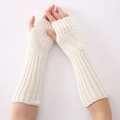 Detailed knit texture and ribbed cuff on cream fingerless arm warmer sleeves - White