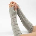 Close-up of light gray knitted fingerless gloves with a triangle geometric textured pattern - Light Gray