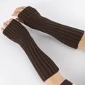 Detail of dark brown knitted fingerless gloves with diagonal ribbed pattern and soft texture - Coffee