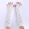 Detail of knitted arm warmers with delicate leaf lace trim and wooden buttons - White