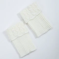 Close-up of white knitted boot cuffs with scallop hollow pattern and ribbed texture - One Size / White