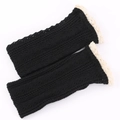 Detail of black knit leg warmers featuring intricate crochet mesh and white lace trim - One Size / Black