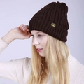 Close-up of dark brown cable knit beanie with side logo label on a model for winter style - Adjustable / Coffee