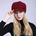 Close-up of wine red knitted beanie with peak and wave pattern texture for winter - One Size / Dark Red