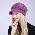 Close-up of a women's purple knitted beret with warm lining and stylish visor - One Size / Rose Red