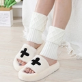 Chic beige diamond knit leg warmers paired with plush slippers for cozy winter style - White