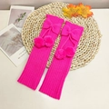 Rose pink cable knit leg warmers with cute decorative bow and soft plush pom-poms - One Size / Rose Red