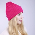Side view of a bright rose pink ribbed knit beanie showing thick winter texture - One Size / Rose Red