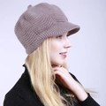 Detail of grey-pink knit peaked beret showing textured wave pattern on a female model - One Size / Khaki