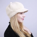 Detail of cream knit newsboy cap showing wave pattern texture and warm fleece lining - One Size / Beige