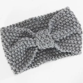 Detail of grey chunky knit headband featuring a twisted knot and textured wool pattern - Light Gray