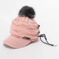 Pink knitted peaked cap featuring a large grey faux fur pompom and drawstring detail - Pink