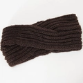 Macro shot of dark brown chunky knit texture and trendy knotted cross design on headband - Coffee
