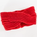 Detail of red cable knit headband showing ribbed texture and stylish knot cross - Red
