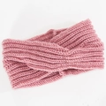 Detailed view of dust pink knitted headband with cross twist and vertical ribbing - Pink