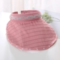 Detail of pink knitted sun visor with silver chain trim and white dotted edge - One Size / Pink