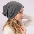 Close-up of grey knit beanie with vertical rhinestone patterns on a soft fabric - One Size / Dark Gray
