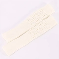 Close-up of cream knit fingerless gloves with detailed jacquard leaf pattern texture - One Size / White