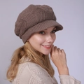 Detailed close-up of brown chunky knit newsboy hat with geometric textured pattern - One Size / Khaki