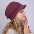 Macro view of burgundy knitted beanie with visor showing detailed herringbone stitch texture - One Size / Rose Red