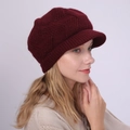 Close-up of deep wine red knit baker boy hat with 3D geometric weave texture detail - One Size / Dark Red