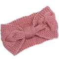 Close-up detail of pink chunky knit headband with bow design and soft wool texture - Pink