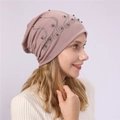 Detail of pink cotton beanie featuring elegant rhinestone and pearl vine embellishments - Pink