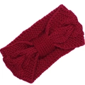 Detail of wine red knitted headband featuring a warm twist bow and soft knit texture - Wine Red