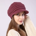 Detailed close-up of dark wine red knitted visor beanie with thick ribbed texture - Adjustable / Rose Red