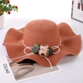 Women's wide brim straw sun hat in brick red with wave edge and floral ornament - One Size / Orange