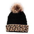 Detail of winter knit hat with fluffy pom-pom and stylish leopard print cuff - Black