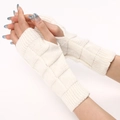 White knitted fingerless gloves with triangle pattern and thumb hole for winter warmth - White