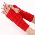 Macro detail of red cable-knit fingerless gloves with soft ribbed cuffs and textured patterns - Red