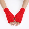 Detail of red cable-knit fingerless gloves showing premium knit texture and pattern - Red