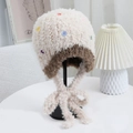 Winter plush trapper hat with colorful buttons and earflaps in cream and brown - One Size / Off White