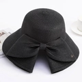 Eleganter schwarzer Strohhut mit breiter Krempe, Schleife und M-Metall-Emblem Damen - Einheitsgröße / Schwarz