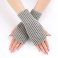 Detailed view of grey ribbed knit fingerless gloves with elastic vertical stripes texture - Light Gray
